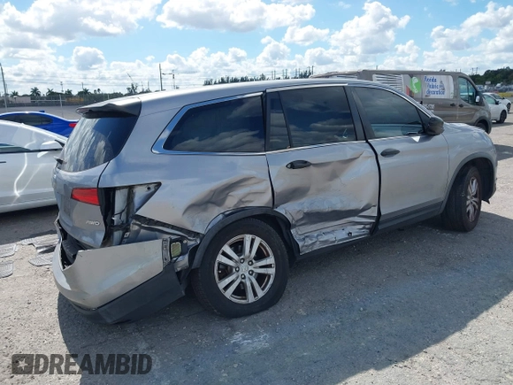 2016 Honda Pilot LX with VIN 5FNYF6H1XGB099987, listed as a IAAI auction lot 41556979 with 98,373 mi miles. Bid and sale history available at carsss.com. Image 4.