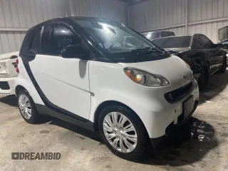 2012 Smart fortwo Pure z VIN WMEEJ3BA5CK540092, wystawiony jako Copart lot #45064065 z przebiegiem 59 356 mil mil oraz Szkody całkowita. Historia ofert i sprzedaży dostępna na DreamBid. Obrazek 1.