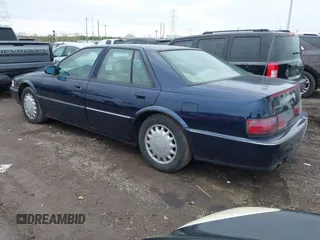 1993 Cadillac Seville Touring STS z VIN 1G6KY5297PU804313, wystawiony jako IAAI lot #42001104 z przebiegiem 242 756 mil mil oraz . Historia ofert i sprzedaży dostępna na DreamBid. Obrazek 3.