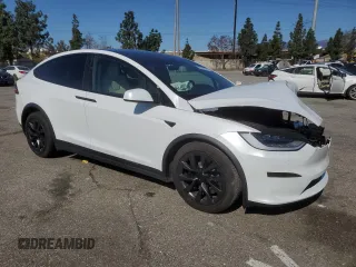 2023 Tesla Model X with VIN 7SAXCDE52PF378496, listed as a Copart auction lot 49455825 with Not Provided miles and Salvage Title. Bid and sale history available at DreamBid. Image 4.