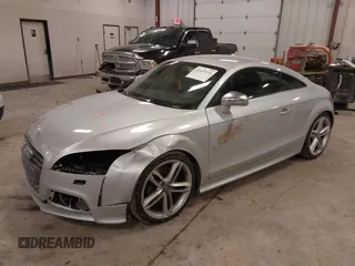 2015 Audi TTS 2.0T z VIN TRUB1AFK2F1000143, wystawiony jako IAAI lot #41649250 z przebiegiem 110 321 mil mil oraz . Historia ofert i sprzedaży dostępna na DreamBid. Obrazek 2.