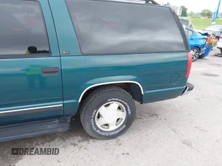1996 GMC Suburban z VIN 1GKFK16ROTJ725925, wystawiony jako IAAI lot #42244433 z przebiegiem 123 837 mil mil oraz . Historia ofert i sprzedaży dostępna na DreamBid. Obrazek 12.