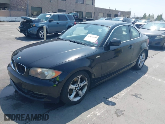 2011 BMW 1 Series 128i with VIN WBAUP9C51BVL90277, listed as a IAAI auction lot 42572690 with 153,427 mi miles and . Bid and sale history available at DreamBid. Image 2.