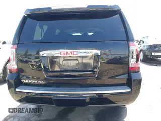 2015 GMC Yukon XL Denali with VIN 1GKS1JKJ1FR134428, listed as a IAAI auction lot 42149588 with 116,207 mi miles. Bid and sale history available at carsss.com. Image 16.