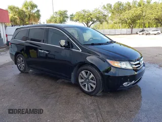 2015 Honda Odyssey Touring Elite with VIN 5FNRL5H91FB055906, listed as a IAAI auction lot 42598819 with 220,308 mi miles and . Bid and sale history available at DreamBid. Image 1.