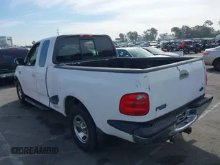 2001 Ford F-150 XL with VIN 1FTRX07L91KA77460, listed as a IAAI auction lot 41686519 with 185,286 mi miles. Bid and sale history available at carsss.com. Image 3.
