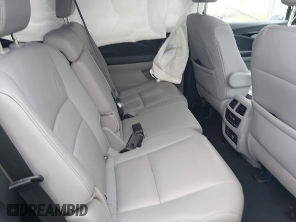 2017 Honda Pilot Touring with VIN 5FNYF6H90HB052474, listed as a IAAI auction lot 42291464 with 103,288 mi miles and . Bid and sale history available at DreamBid. Image 8.