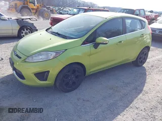 2011 Ford Fiesta SES with VIN 3FADP4FJ4BM108857, listed as a IAAI auction lot 41848272 with 138,943 mi miles. Bid and sale history available at carsss.com. Image 2.