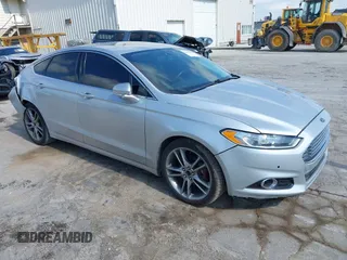 2016 Ford Fusion Titanium z VIN 3FA6P0D98GR301498, wystawiony jako IAAI lot #42611236 z przebiegiem 86 688 mil mil oraz . Historia ofert i sprzedaży dostępna na DreamBid. Obrazek 1.