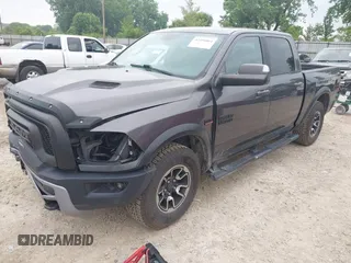 2017 Ram 1500 Rebel with VIN 1C6RR7YT5HS610293, listed as a IAAI auction lot 42454064 with 103,515 mi miles and . Bid and sale history available at DreamBid. Image 2.