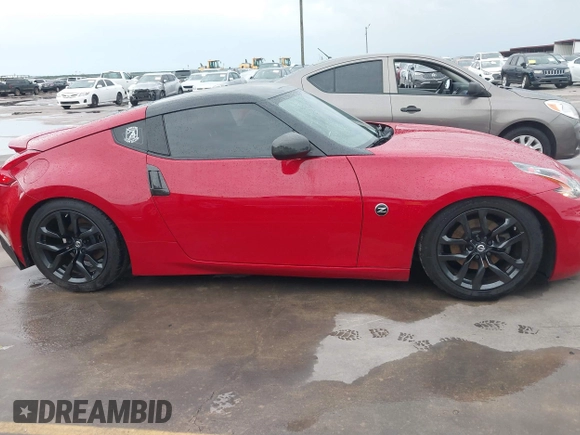 2016 Nissan 370Z z VIN JN1AZ4EHXGM932681, wystawiony jako IAAI lot #42350850 z przebiegiem 94 586 mil mil oraz . Historia ofert i sprzedaży dostępna na DreamBid. Obrazek 13.