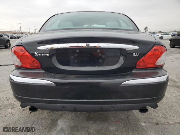 2002 Jaguar X-Type with VIN SAJEA51C02WC46124, listed as a Copart auction lot 50656395 with 50,815 mi miles and Salvage Title. Bid and sale history available at carsss.com. Image 6.