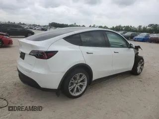 2023 Tesla Model Y Long Range z VIN 7SAYGDEE0PF802511, wystawiony jako Copart lot #54959415 z przebiegiem 12 902 mil mil oraz Szkoda całkowita • Salvage title. Historia ofert i sprzedaży dostępna na DreamBid. Obrazek 3.