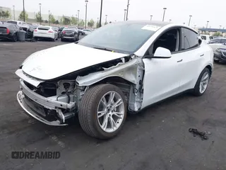 2023 Tesla Model Y Long Range z VIN 7SAYGDEE5PA063097, wystawiony jako IAAI lot #42171871 z przebiegiem Nie podano mil oraz . Historia ofert i sprzedaży dostępna na DreamBid. Obrazek 2.