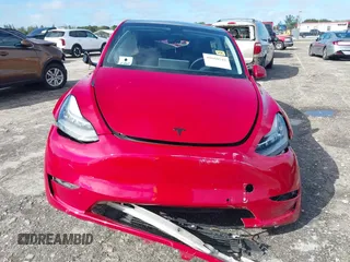 2022 Tesla Model Y Long Range z VIN 7SAYGDEE1NF385414, wystawiony jako IAAI lot #41660542 z przebiegiem 54 075 mil mil oraz . Historia ofert i sprzedaży dostępna na DreamBid. Obrazek 12.