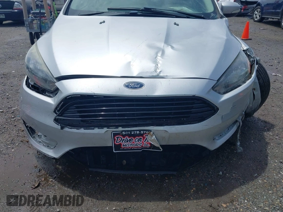 2017 Ford Focus SE with VIN 1FADP3FE4HL295573, listed as a IAAI auction lot 39562568 with 96,939 mi miles and . Bid and sale history available at carsss.com. Image 17.