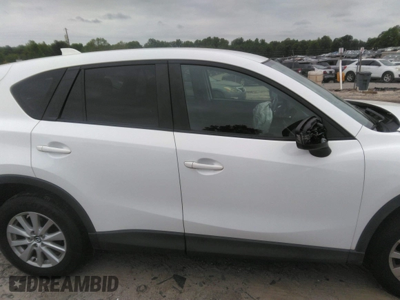 2014 Mazda CX-5 Touring z VIN JM3KE4CY0E0303748, wystawiony jako IAAI lot #42127406 z przebiegiem Nie podano mil oraz . Historia ofert i sprzedaży dostępna na DreamBid. Obrazek 12.