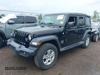 2018 Jeep Wrangler Unlimited Sport S with VIN 1C4HJXDG3JW150232, listed as a IAAI auction lot 42379385 with 60,679 mi miles and . Bid and sale history available at DreamBid. Image 2.