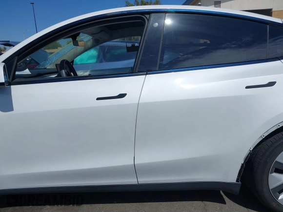 2023 Tesla Model Y Long Range with VIN 7SAYGDEE2PF632121, listed as a IAAI auction lot 41798780 with 53,773 mi miles. Bid and sale history available at carsss.com. Image 14.