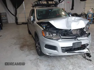 2011 Volkswagen Touareg Exec with VIN WVGFK9BP4BD005986, listed as a IAAI auction lot 41183877 with 109,005 mi miles and . Bid and sale history available at DreamBid. Image 1.