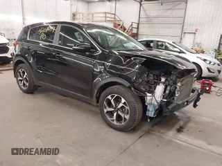 2020 Kia Sportage LX with VIN KNDPMCACXL7804797, listed as a IAAI auction lot 42011299 with 49,793 mi miles and . Bid and sale history available at carsss.com. Image 1.