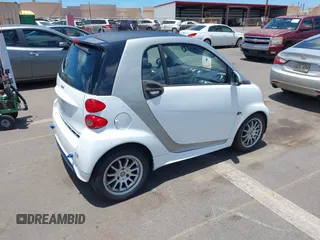 2013 Smart fortwo Pure with VIN WMEEJ3BA8DK605597, listed as a IAAI auction lot 42395754 with 55,637 mi miles and . Bid and sale history available at DreamBid. Image 4.