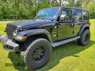 2018 Jeep Wrangler Unlimited Sahara z VIN 1C4HJXENXJW251085, wystawiony jako IAAI lot #42284623 z przebiegiem 58 706 mil mil oraz . Historia ofert i sprzedaży dostępna na DreamBid. Obrazek 1.