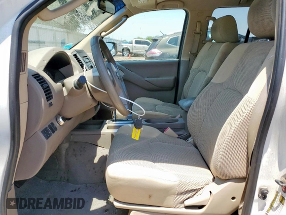 2009 Nissan Frontier SE with VIN 1N6AD07U29C400846, listed as a Copart auction lot 56419735 with 143,005 mi miles and Salvage title. Bid and sale history available at DreamBid. Image 7.