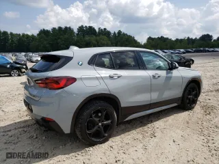 2021 BMW X2 xDrive28i with VIN WBXYJ1C04M5S67817, listed as a Copart auction lot 68214304 with 54,454 mi miles and Salvage Title. Bid and sale history available at carsss.com. Image 3.