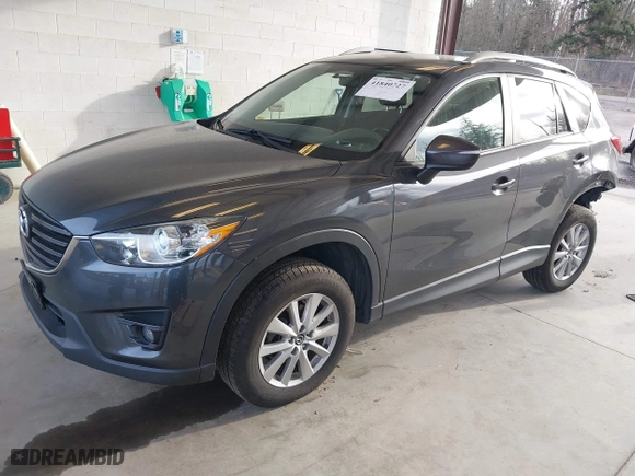 2016 Mazda CX-5 Touring with VIN JM3KE4CY4G0779827, listed as a IAAI auction lot 41840727 with 91,367 mi miles. Bid and sale history available at carsss.com. Image 18.