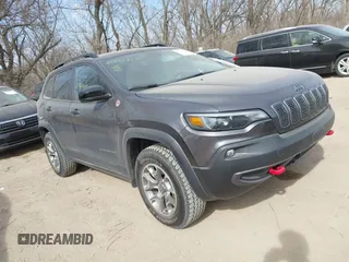 2022 Jeep Cherokee Trailhawk z VIN 1C4PJMBX4ND536592, wystawiony jako IAAI lot #41792322 z przebiegiem 43 611 mil mil oraz . Historia ofert i sprzedaży dostępna na DreamBid. Obrazek 1.