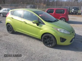 2011 Ford Fiesta SES with VIN 3FADP4FJ4BM108857, listed as a IAAI auction lot 41848272 with 138,943 mi miles. Bid and sale history available at carsss.com. Image 1.