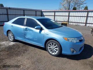 2014 Toyota Camry Hybrid LE with VIN 4T1BD1FK7EU098824, listed as a IAAI auction lot 42063119 with 112,759 mi miles. Bid and sale history available at carsss.com. Image 1.