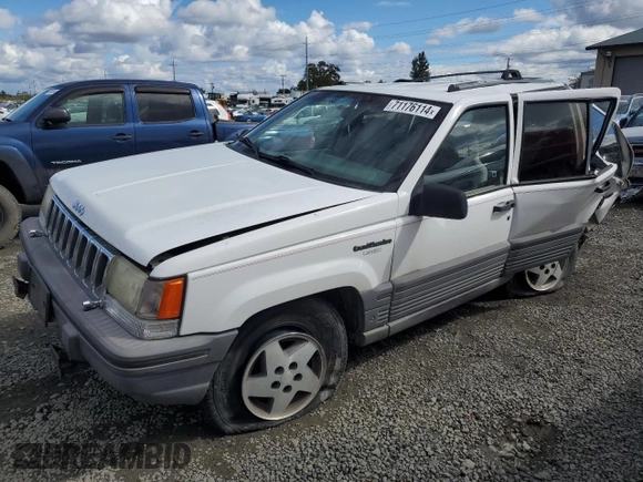 1994 Jeep Grand Cherokee Laredo with VIN 1J4GZ58Y2RC207099, listed as a Copart auction lot 71176114 with 127,110 mi miles and Salvage Title. Bid and sale history available at carsss.com. Image 1.