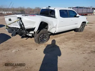2021 Toyota Tacoma 4WD SR5 with VIN 3TYDZ5BN3MT001860, listed as a IAAI auction lot 41269423 with 23,378 mi miles. Bid and sale history available at carsss.com. Image 4.