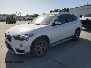 2019 BMW X1 xDrive28i with VIN WBXHT3C53K5L35670, listed as a Copart auction lot 53493245 with 14,201 mi miles and Salvage Title. Bid and sale history available at carsss.com. Image 1.