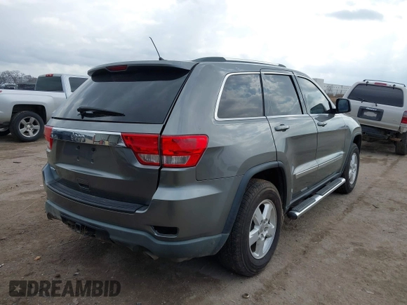 2013 Jeep Grand Cherokee Laredo with VIN 1C4RJEAG2DC571569, listed as a IAAI auction lot 41100518 with 98,265 mi miles. Bid and sale history available at carsss.com. Image 4.