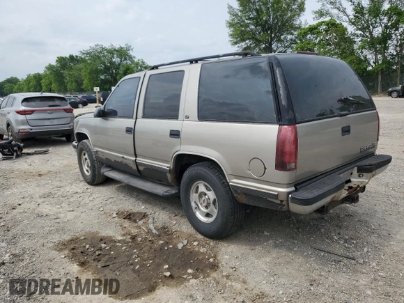1999 Chevrolet Tahoe Z71 with VIN 1GNEK13R6XJ301562, listed as a Copart auction lot 59684595 with 200,561 mi miles and Salvage title. Bid and sale history available at DreamBid. Image 2.