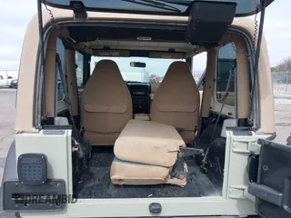 1999 Jeep Wrangler Sahara with VIN 1J4FY49S0XP480017, listed as a IAAI auction lot 41642577 with 154,068 mi miles. Bid and sale history available at carsss.com. Image 8.