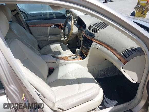 2003 Mercedes-Benz E-Class 3.2L with VIN WDBUF65JX3A236768, listed as a IAAI auction lot 42094824 with 251,896 mi miles. Bid and sale history available at carsss.com. Image 5.