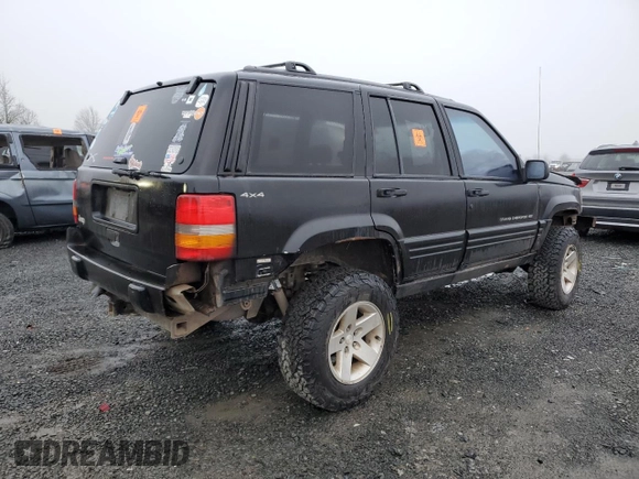 1998 Jeep Grand Cherokee Laredo with VIN 1J4GZ48S0WC171138, listed as a Copart auction lot 85502794 with 0 mi miles and Salvage Title. Bid and sale history available at carsss.com. Image 3.