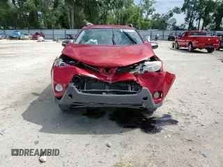 2014 Toyota RAV4 LE with VIN JTMZFREV5EJ021314, listed as a Copart auction lot 61082275 with 164,359 mi miles and Salvage title. Bid and sale history available at DreamBid. Image 14.