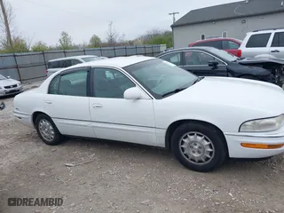 1999 Buick Park Avenue Ultra with VIN 1G4CU5217X4658627, listed as a IAAI auction lot 42013174 with 148,856 mi miles. Bid and sale history available at carsss.com. Image 13.