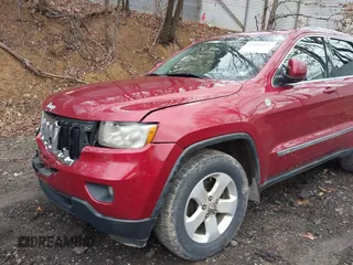 2012 Jeep Grand Cherokee Laredo with VIN 1C4RJFAG7CC123669, listed as a IAAI auction lot 42001472 with 164,806 mi miles. Bid and sale history available at carsss.com. Image 18.