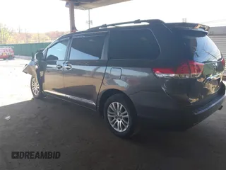 2014 Toyota Sienna XLE with VIN 5TDYK3DC5ES433949, listed as a IAAI auction lot 42095625 with 337,642 mi miles and . Bid and sale history available at DreamBid. Image 3.