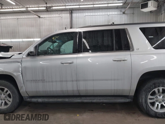 2018 Chevrolet Suburban LT z VIN 1GNSKHKC2JR201282, wystawiony jako IAAI lot #41312994 z przebiegiem 99 783 mil mil oraz . Historia ofert i sprzedaży dostępna na DreamBid. Obrazek 15.