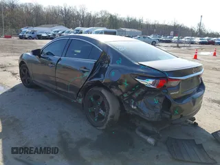2016 Mazda 6 i Sport with VIN JM1GJ1U59G1402840, listed as a IAAI auction lot 41920724 with 147,527 mi miles and . Bid and sale history available at DreamBid. Image 3.