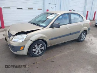 2009 Kia Rio SX with VIN KNADE223196512461, listed as a IAAI auction lot 41520063 with 132,558 mi miles. Bid and sale history available at carsss.com. Image 2.