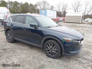 2017 Mazda CX-5 Grand Touring with VIN JM3KFBDL9H0180038, listed as a IAAI auction lot 41394047 with 111,581 mi miles. Bid and sale history available at carsss.com. Image 1.