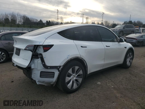2023 Tesla Model Y Long Range with VIN 7SAYGDEE3PA130988, listed as a Copart auction lot 42172185 with 112,136 mi miles and Salvage Title. Bid and sale history available at DreamBid. Image 3.